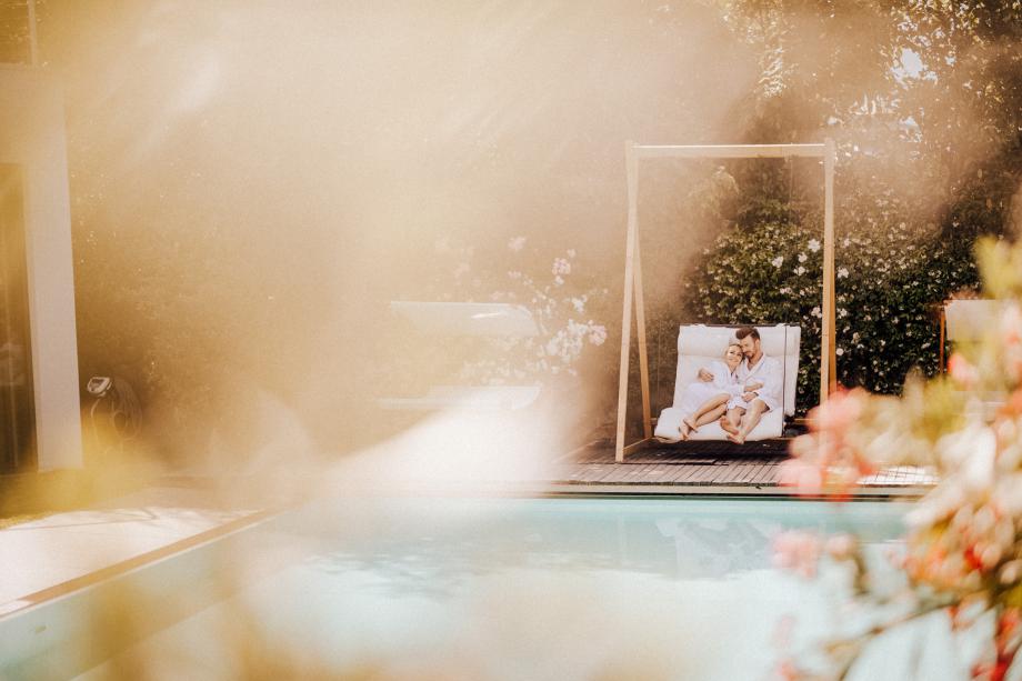 Pool with double floating lounger for couples