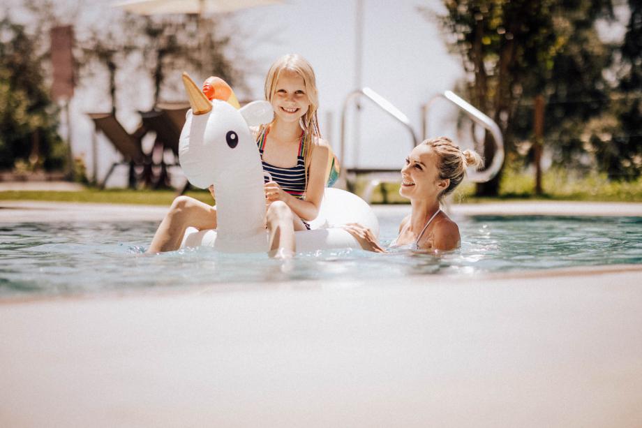 Heated indoor-outdoor pool at the family-friendly hotel in Dorf Tirol